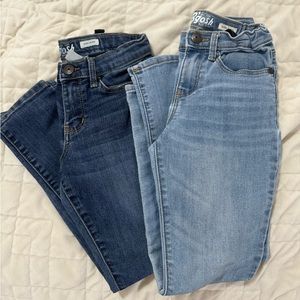2 pairs of girls jeans.